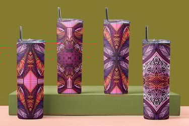 three different colored tumblers with a green background
