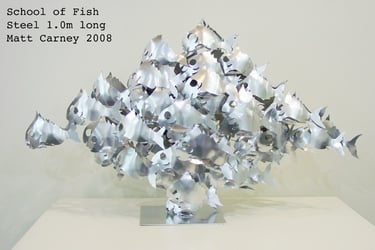 a sculpture of a school of fish