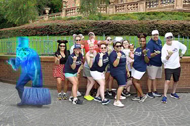 Minnie's Travel Boutique pictured with a hitchhiking ghost in front of the Haunted Mansion at Disney's Magic Kingdom® Park.
