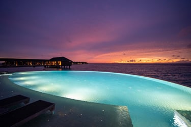 Hurawalhi Maldives main pool sunset