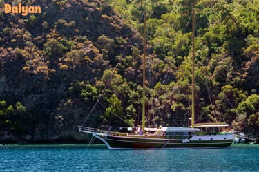 a boat with a sailboat in the water