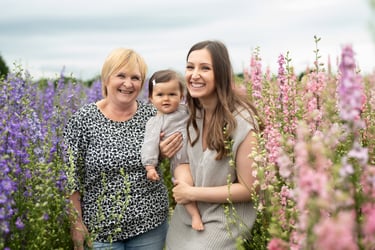 Candid family photo showing 3 generations. Captured by Surrey Family photographer Lauren Gazzard. 
