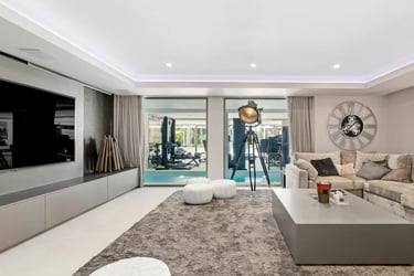 Villa Serenity TV room with large sofa and spa views