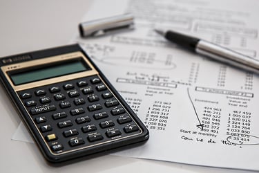 Calculator and financial papers representing financial translations