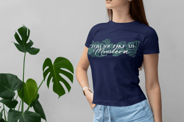 Woman wearing a plant-themed T-shirt styled with botanical accents — Miss Chatty Plants apparel.