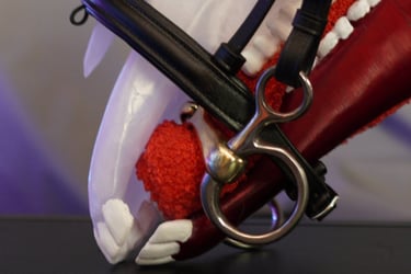 a horse with a red nose and white teeth