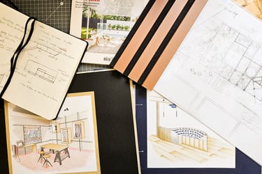 a bunch of drawings of a house on a table