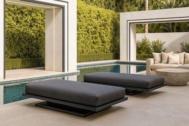 Modern custom-made outdoor furniture with dark cushions by the pool in a high-end backyard, by Solo Home Decor.
