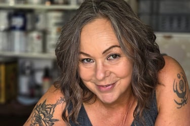 Owner of Absolutely Mintage - Julia -  holds a Festool sander