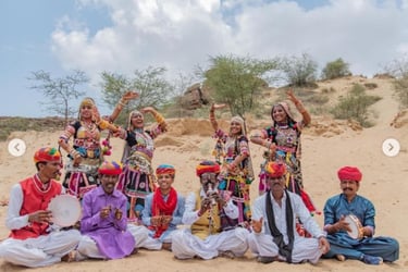 a group of people in traditional indian clothing