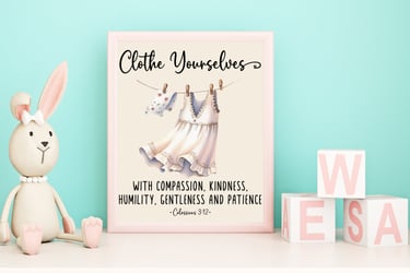Framed print in a childs room, next to bunny and blocks, of a dress on a line "clothe yourselves with compassion, kindness, h