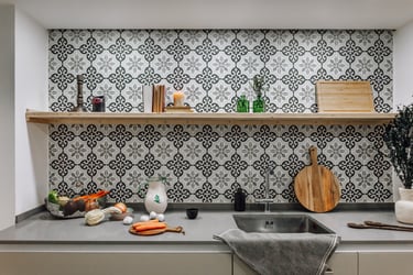 Open-plan kitchen with patterned tiles, neutral tones in Rute apartment interior design