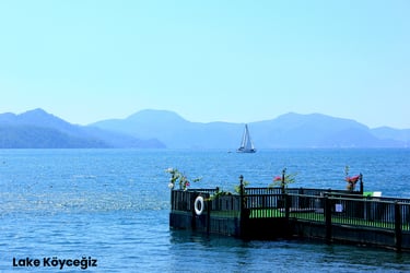 a sailboat is docked at a pier in Lake Köyceğiz, one of the best places to visit in Dalyan