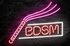 a neon sign with BDSM