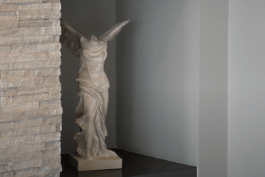 a statue of a woman holding a sword
