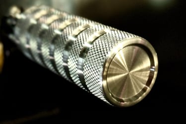 close up of a aluminum foot peg with knurling and grooves
