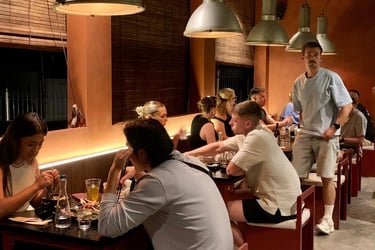Kenji Ramen Bali Padang Linjong busy dining scene - customers enjoying Japanese food Canggu