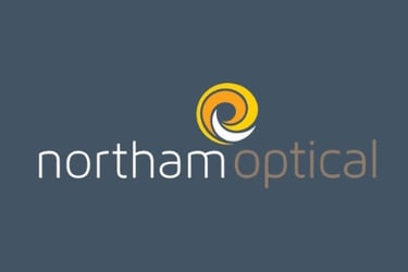 Northam Optical logo with a yellow and white spiral icon above the word "northamoptical" in lowercase white and brown text, s