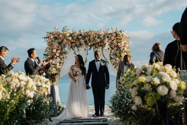 a bride and groom walking down the aisle of a wedding ceremony