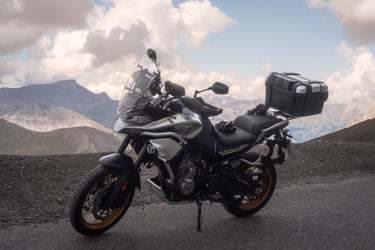 a motorcycle parked on a mountain side
