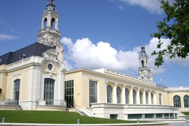 a large white building with towers