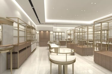 Luxury retail jewelry store interior with gold metal display racks and glass showcases.