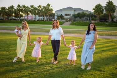 Extended family walking together outdoors during a sunset portrait session in Mesa, Arizona.