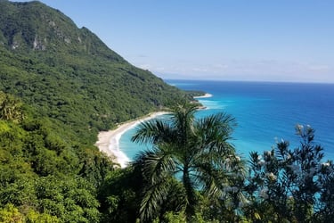 Tropical coastline and lush green mountains in Barahona, Dominican Republic