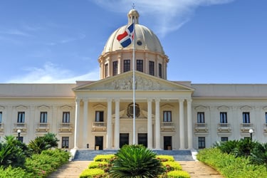 National Palace of the Dominican Republic with flag and blue sky in Santo Domingo