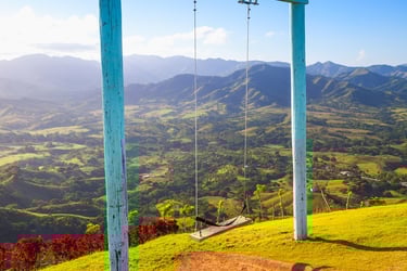 Scenic swing at Montaña Redonda overlooking lush valleys near Los Haitises, Dominican Republic