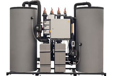 Industrial heat recovery system with insulated water storage tanks and Grundfos circulation pumps.