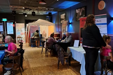 a group of people sitting at tables in a room