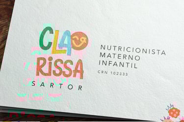 a close up of a business card with a colorful logo
