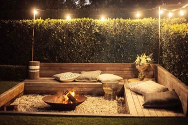 a sunken fire pit with benches