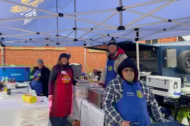 Rod, Wendy, Andrea and Kristin attempting to stay warm whilst serving food at the Xmas in July BBQ