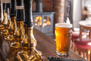 a glass of beer in a bar