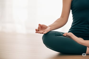 a woman sitting in a yoga pose