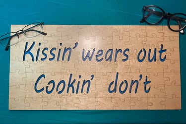 "Kissin' wears out, cookin' don't" jigsaw puzzle