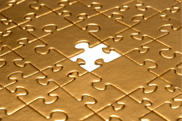 gold puzzle with missing piece