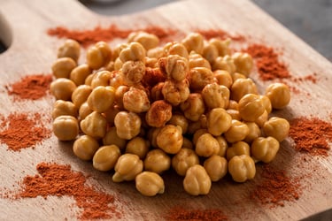 a pile of chickpeasmeal sitting on a cutting board