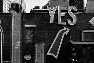 black and white image of signage for a restaurant storefront with the word yes 
