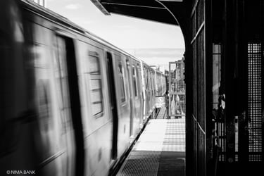 subway platform in bushwick brooklyn with train cars traveling fast creating blur