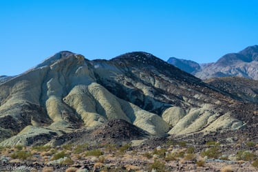 mountainy terrain and blue skies at death valley california