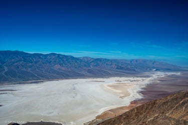 an expansive mountain range from the top of dantes peak overlooking badwater basin