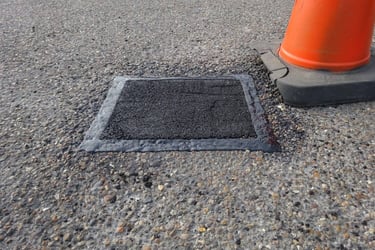 Pothole repair with sealed edges
