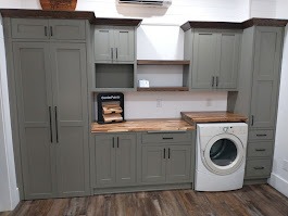 moss green laundry display with butcher block 