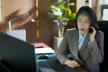 A President staff member in the office, calling Jin Young.