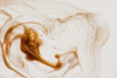 background image - gold glitters swirled on a white surface