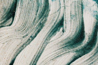 background image - teal glitters spreaded artistically on a white surface