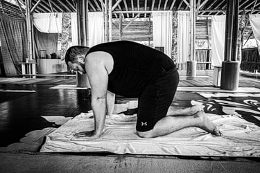 Around 6-9 months, babies balance on their hands and knees, rocking in preparation for crawling.